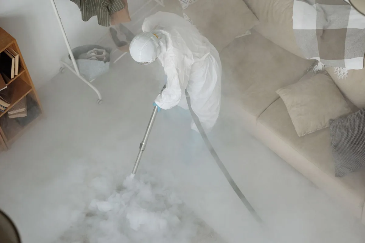 Biohazard cleanup technician in protective equipment, Odenville, AL